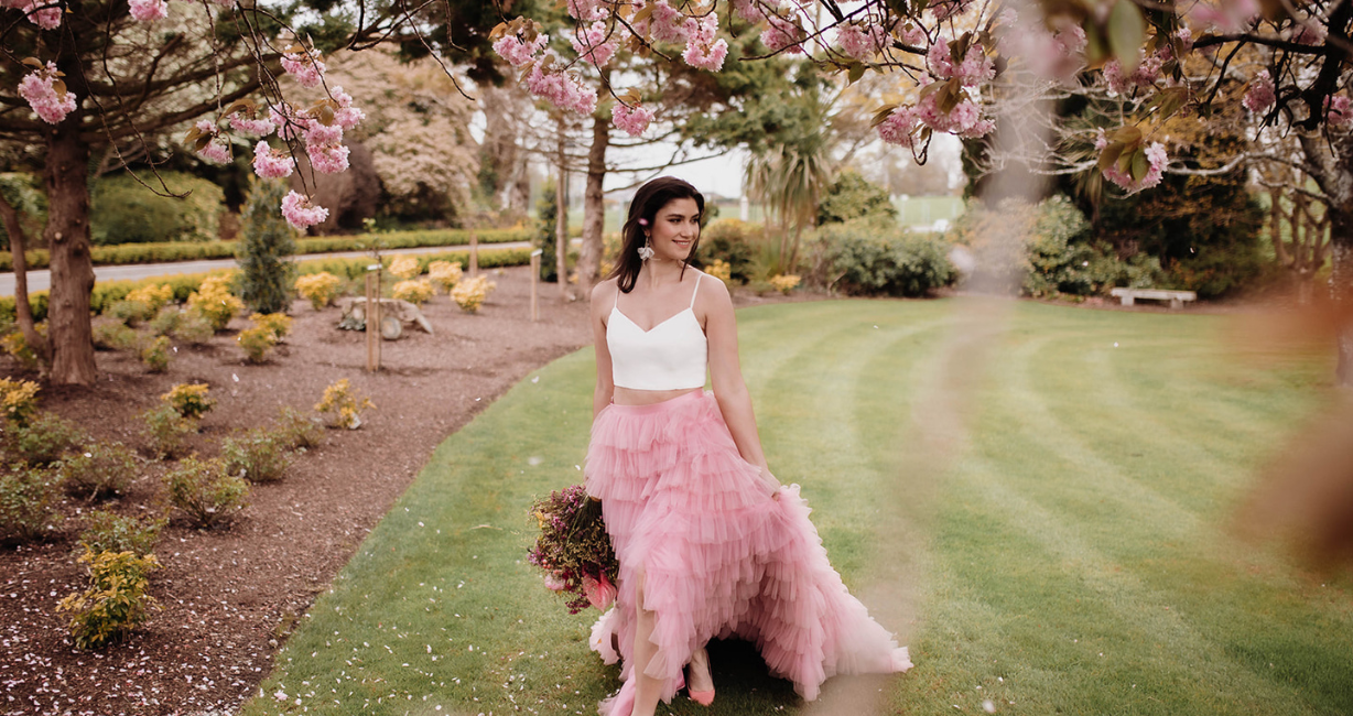 Lovely bride in pink ruffled skirt